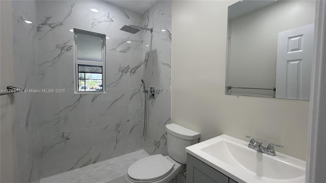 full bath featuring a marble finish shower, toilet, and vanity