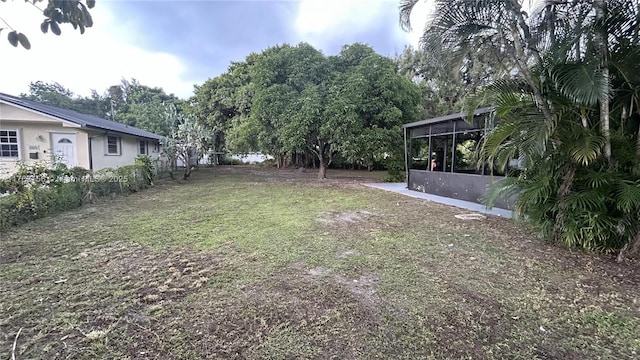 view of yard featuring a sunroom