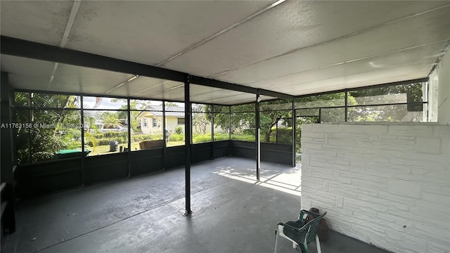 unfurnished sunroom featuring plenty of natural light