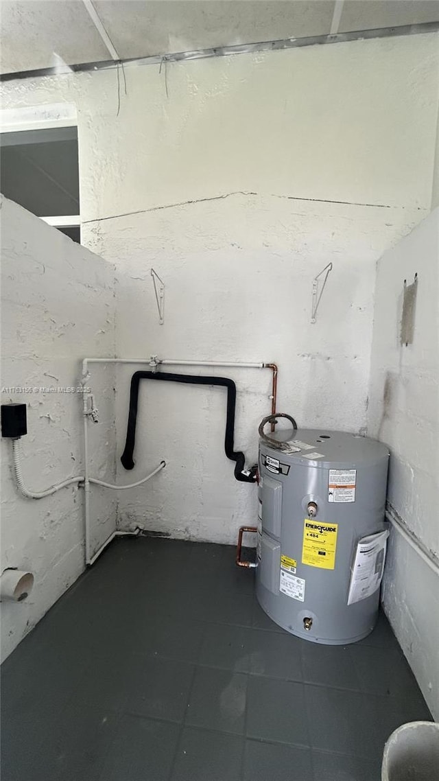 utility room featuring water heater