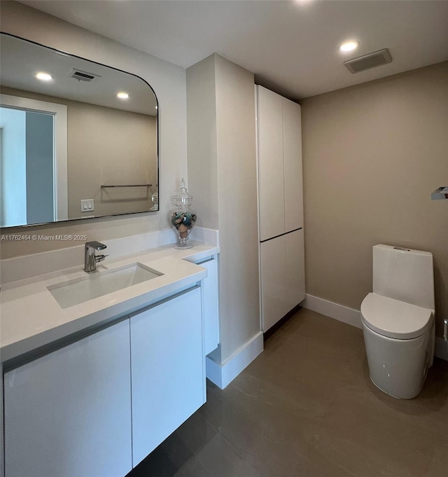 1881 Middle River Dr Unit 207, Fort Lauderdale, FL 33305 - bathroom with visible vents, recessed lighting, toilet, and vanity