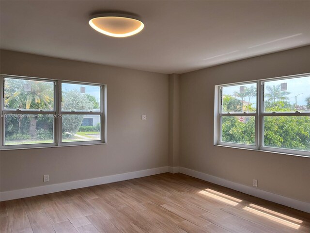 1881 Middle River Dr Unit 207, Fort Lauderdale, FL 33305 - empty room featuring baseboards and light wood-type flooring