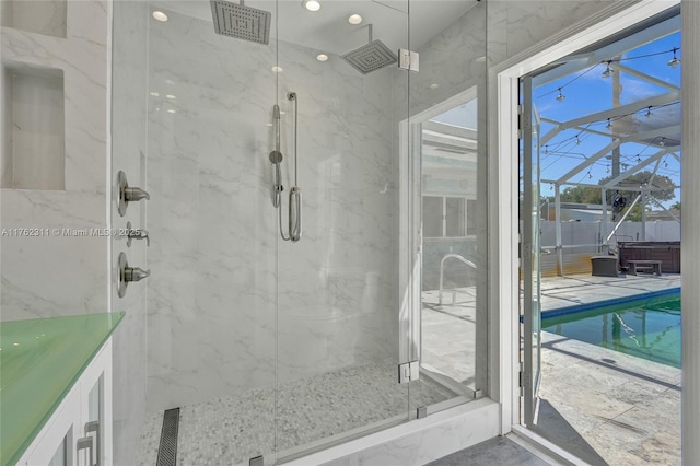 bathroom featuring a marble finish shower and visible vents