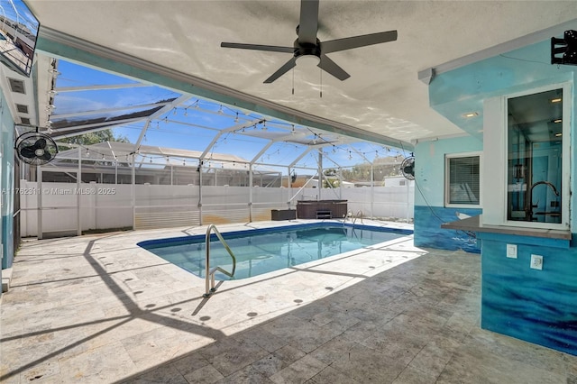 view of pool featuring a fenced in pool, a fenced backyard, ceiling fan, a lanai, and a patio area