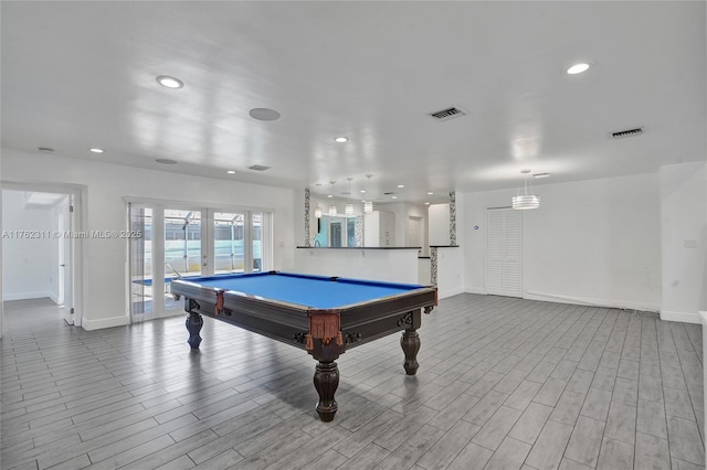 playroom featuring recessed lighting, french doors, visible vents, and wood finished floors