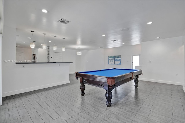 playroom featuring wood finished floors, recessed lighting, baseboards, and visible vents