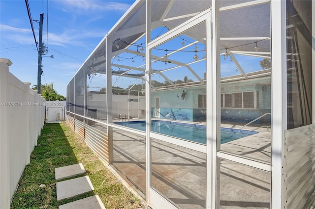 view of pool with a lanai, a fenced backyard, a fenced in pool, and a patio area