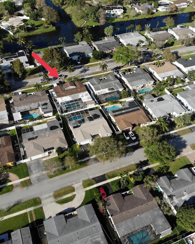 birds eye view of property with a residential view