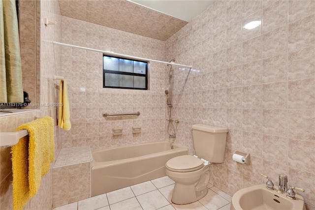 full bathroom featuring tile patterned flooring, tile walls, toilet, and shower / tub combination