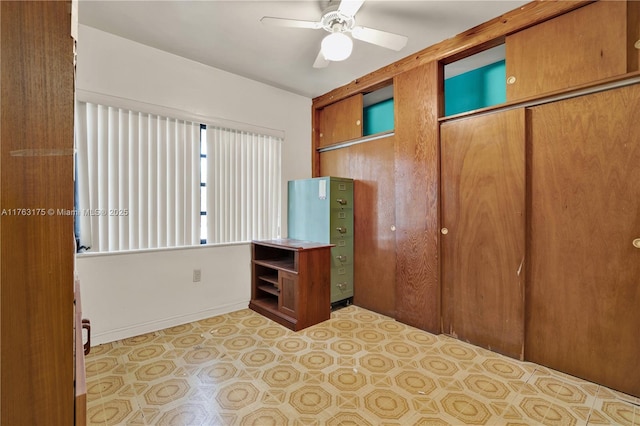 unfurnished bedroom with a closet, ceiling fan, and tile patterned flooring