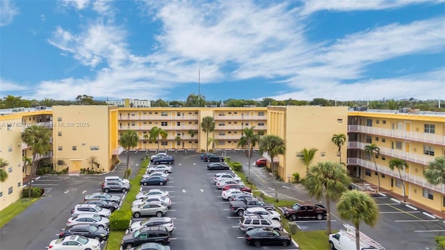 view of building exterior with uncovered parking