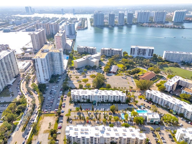 bird's eye view featuring a water view and a city view