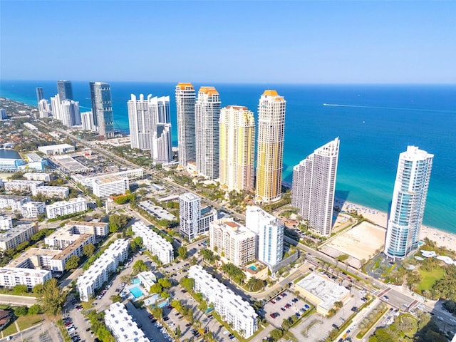 birds eye view of property featuring a view of city and a water view