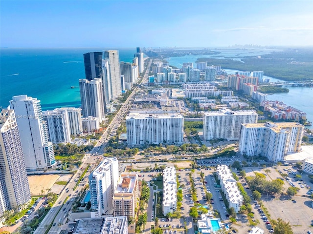 bird's eye view featuring a view of city and a water view