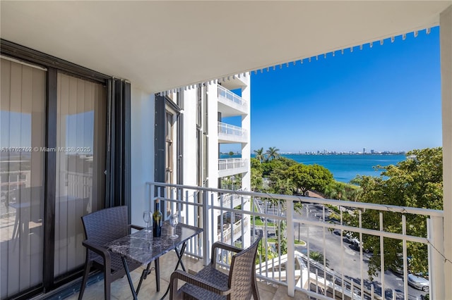 balcony featuring a water view