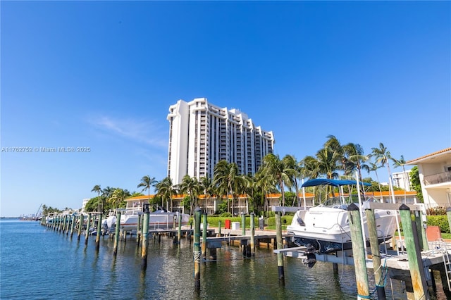 4000 Towerside Ter Unit 610, Miami, FL 33138 - dock area featuring boat lift and a water view