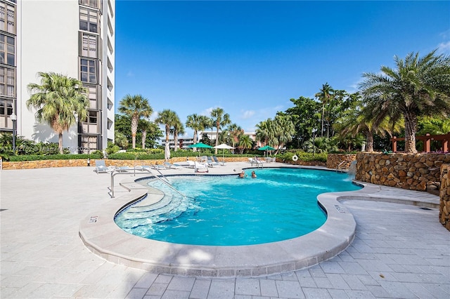 community pool with a patio