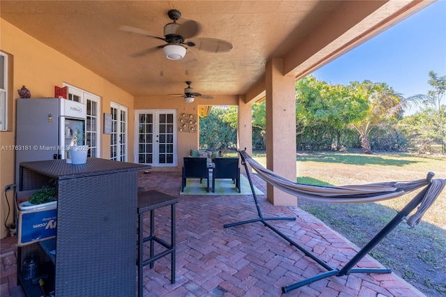 view of patio / terrace featuring french doors and a ceiling fan