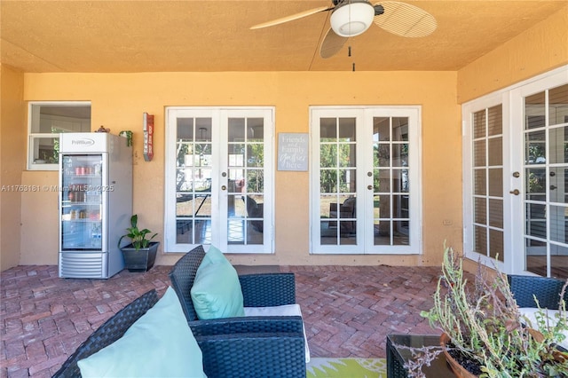 view of patio with french doors and a ceiling fan