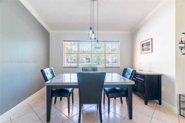 dining space featuring light tile patterned flooring, baseboards, and ornamental molding