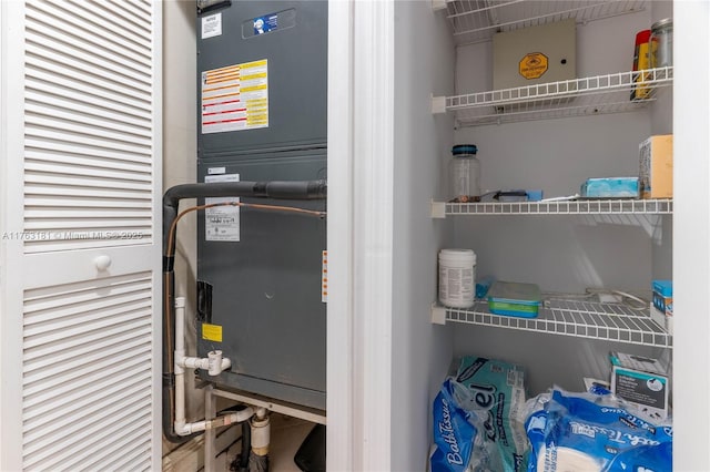 utility room with heating unit