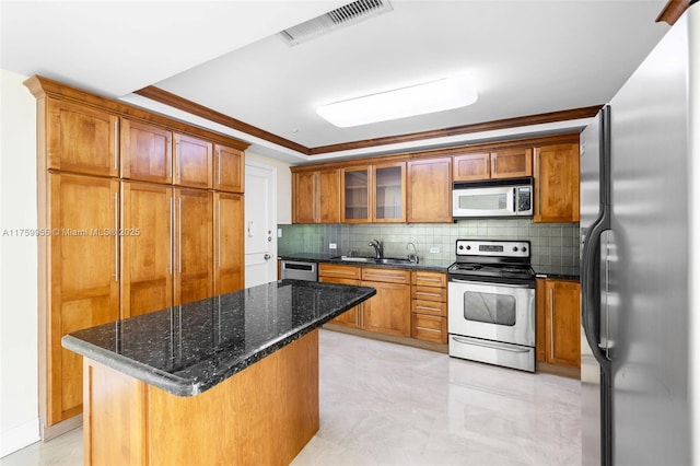 kitchen featuring a sink, visible vents, appliances with stainless steel finishes, and brown cabinetry