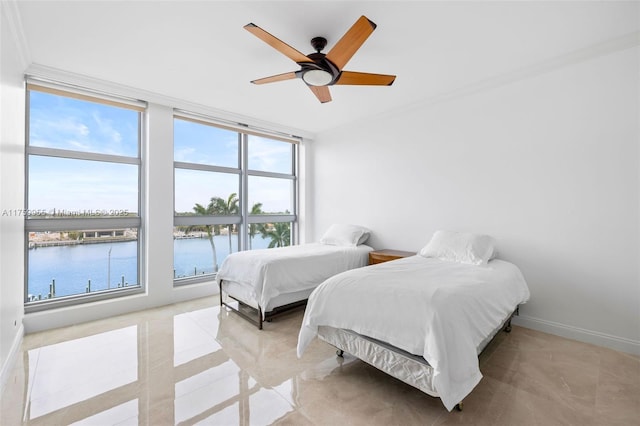 bedroom featuring baseboards, a water view, a ceiling fan, and crown molding