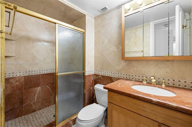 bathroom featuring visible vents, a shower stall, toilet, decorative backsplash, and vanity