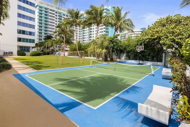 view of sport court featuring community basketball court and a yard