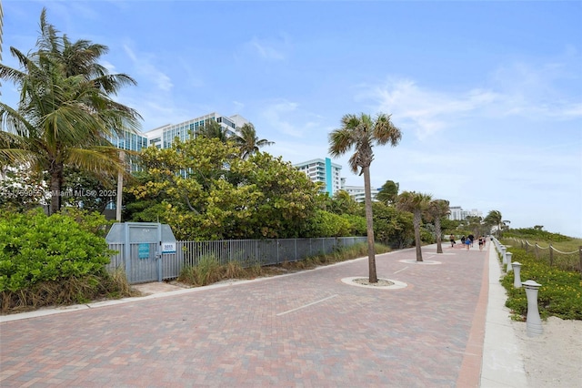 view of community featuring fence