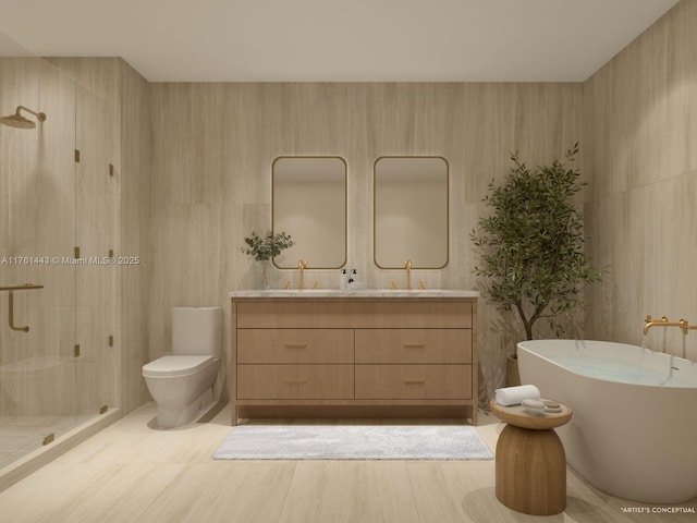 bathroom with a shower stall, a freestanding bath, toilet, double vanity, and wood finished floors