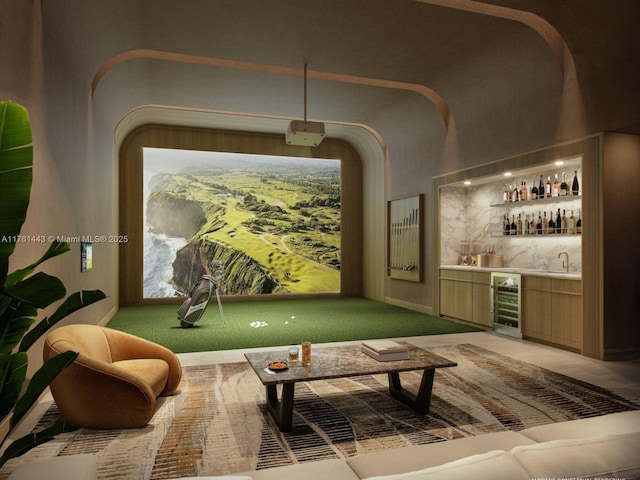 interior space with indoor bar, beverage cooler, and golf simulator