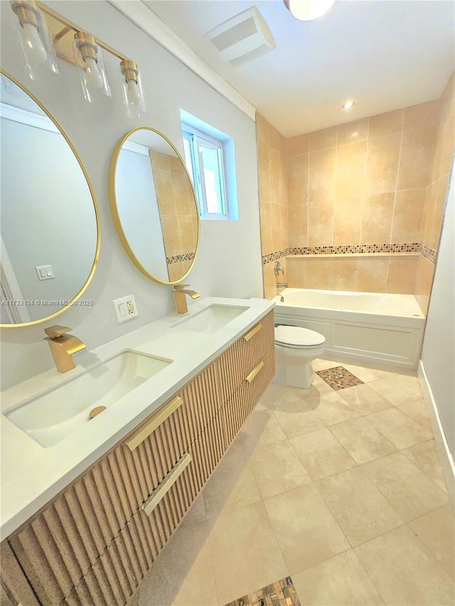 bathroom with tile patterned flooring, a tub to relax in, visible vents, and a sink