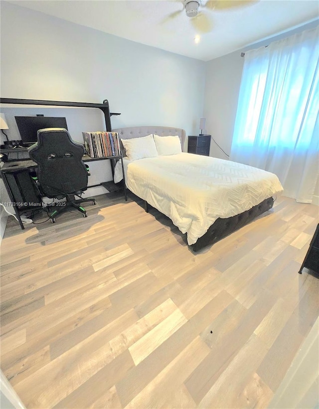 bedroom featuring ceiling fan and wood finished floors