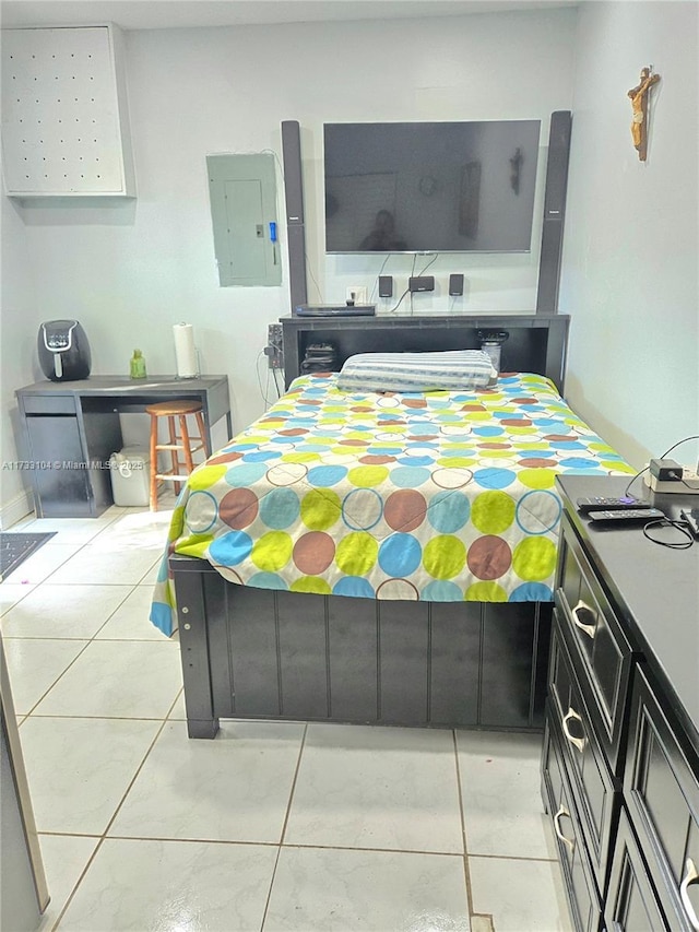 bedroom with electric panel and light tile patterned floors