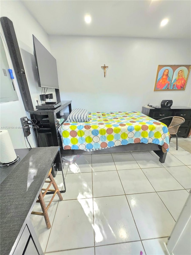 bedroom with recessed lighting and tile patterned flooring