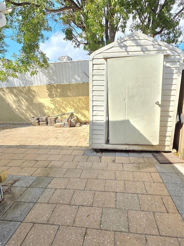 view of shed with a fenced backyard