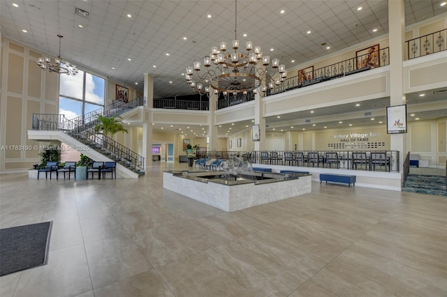 lobby featuring stairway and visible vents