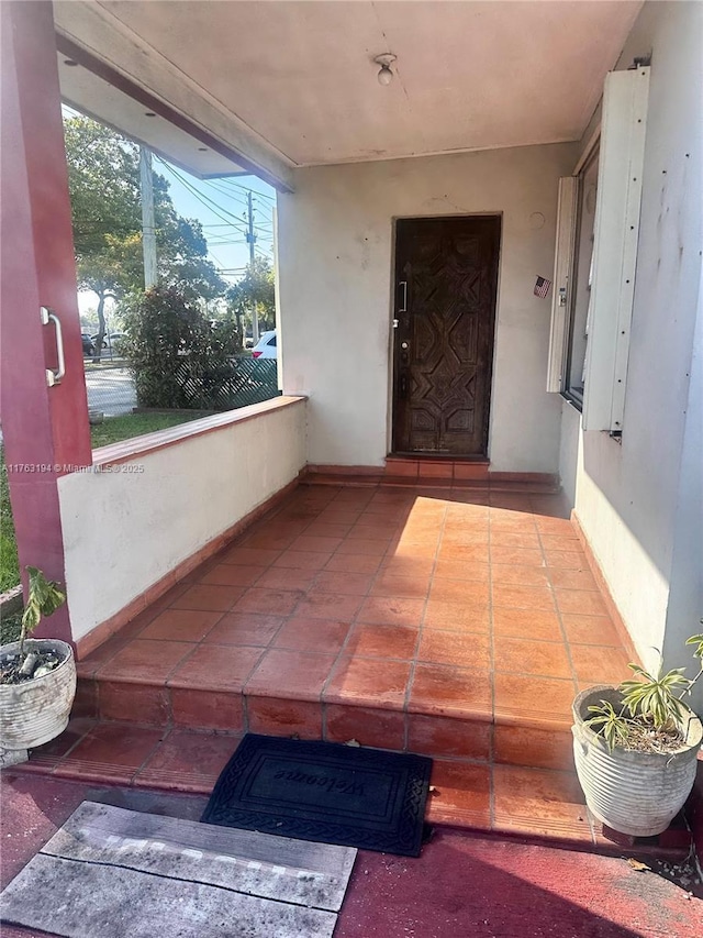 entrance to property with stucco siding