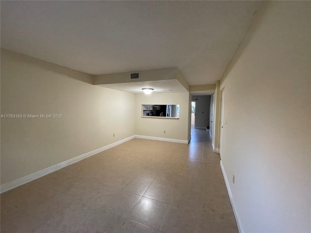 interior space with visible vents and baseboards