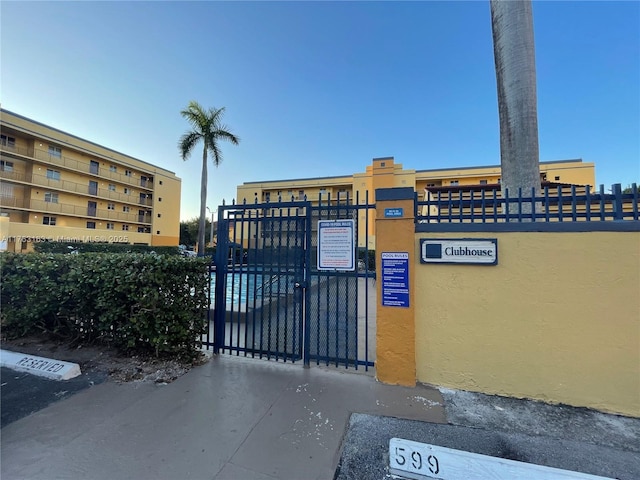 view of gate with fence