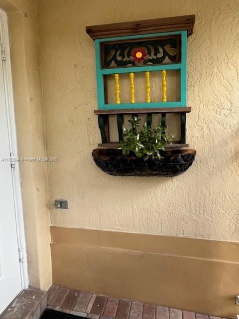 exterior details featuring stucco siding