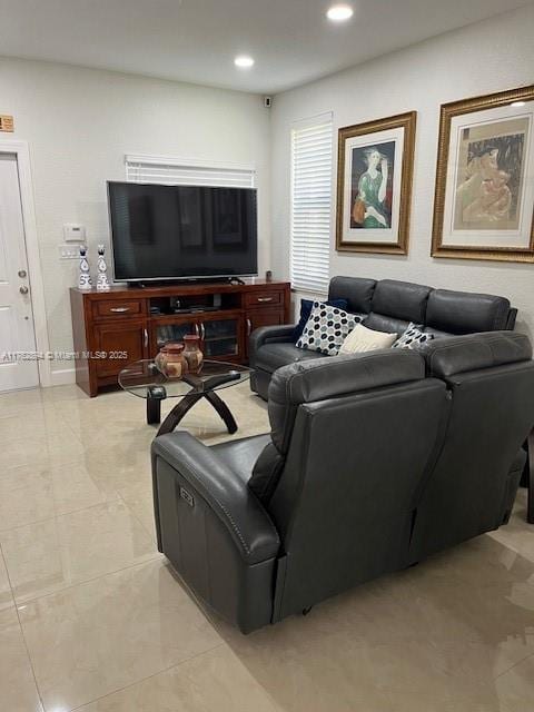 living room featuring recessed lighting and light tile patterned flooring