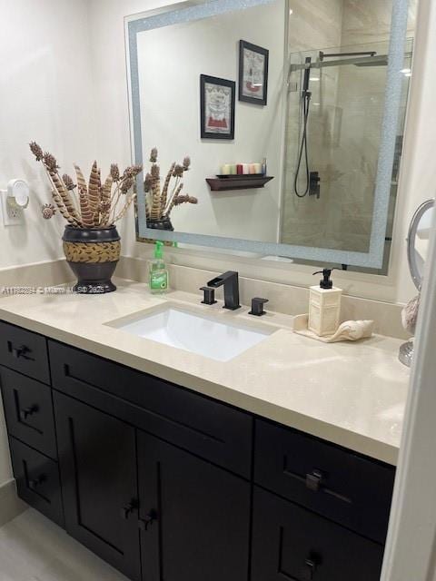 full bath featuring vanity and a stall shower