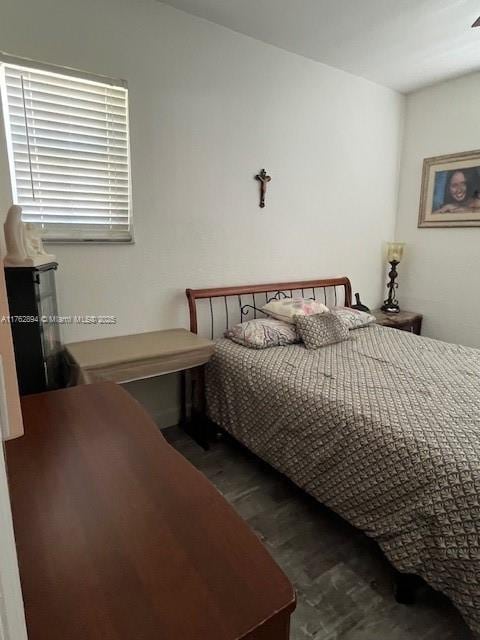 bedroom with wood finished floors