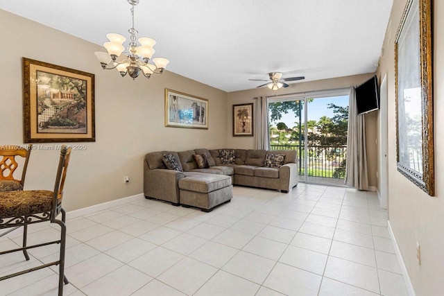 living area featuring light tile patterned floors, ceiling fan with notable chandelier, and baseboards