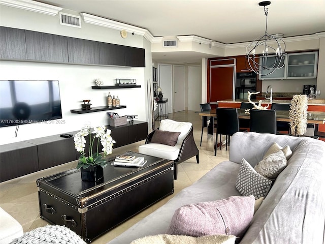 living area featuring visible vents, an inviting chandelier, and crown molding