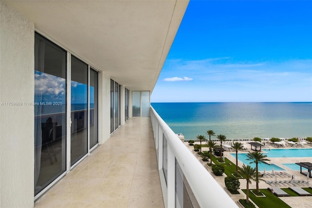 balcony featuring a water view