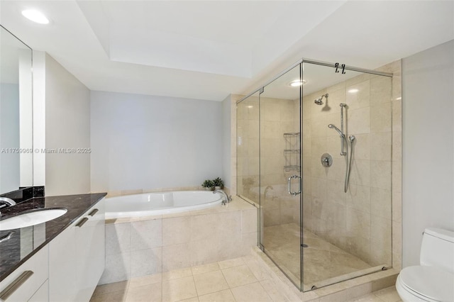 bathroom with toilet, a stall shower, a bath, tile patterned floors, and vanity