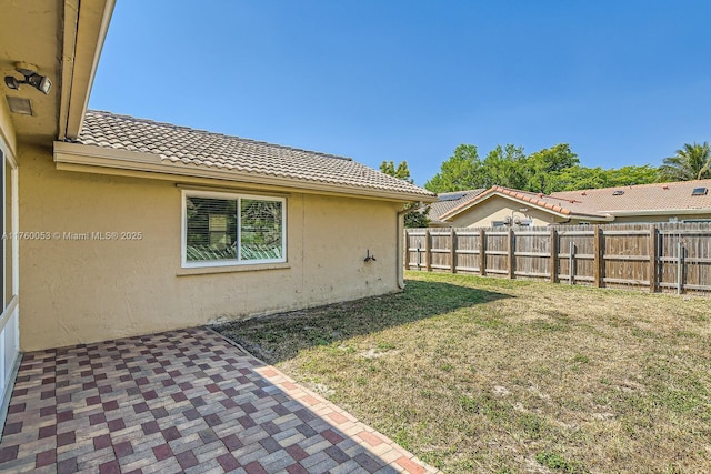 view of yard featuring a patio and fence